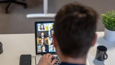 Person sat at a desk in an online meeting