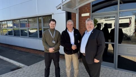Steve Postlethwaite Programme Director far right receives the keys to Delkias new production facility in Haydock Merseyside Photo Delkia