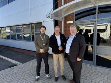 Steve Postlethwaite Programme Director far right receives the keys to Delkias new production facility in Haydock Merseyside Photo Delkia