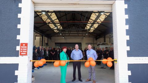 Dianne cutting ribbon at DM Engineering opening